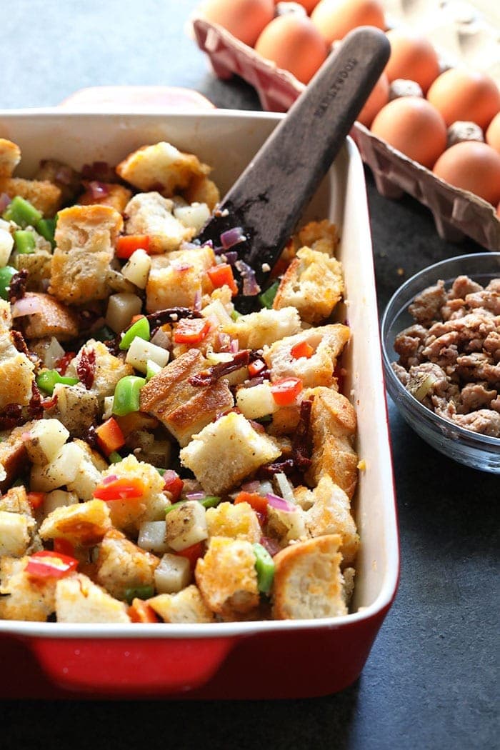 Ingredients for spicy italian sausage casserole in a baking dish