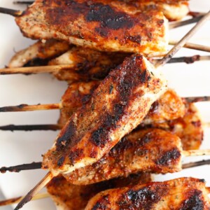 Chicken skewers on a plate.