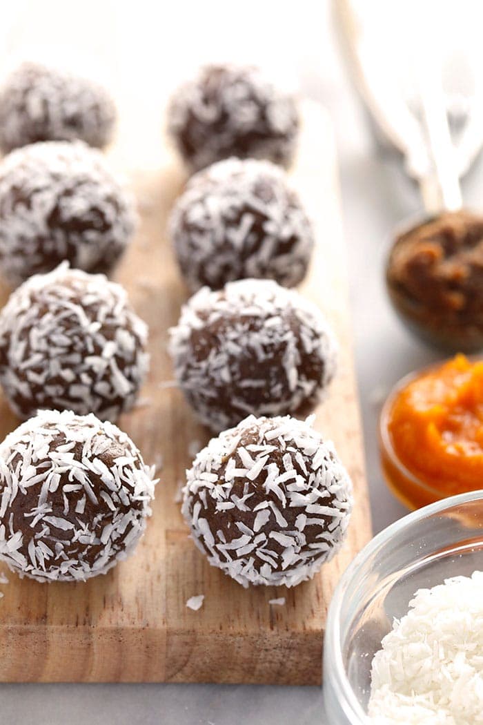 Energy balls on cutting board