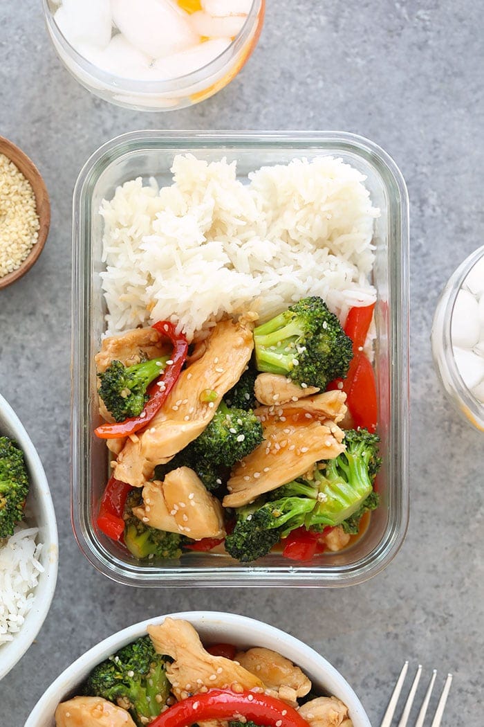 Chicken and broccoli stir fry in a meal prep container.