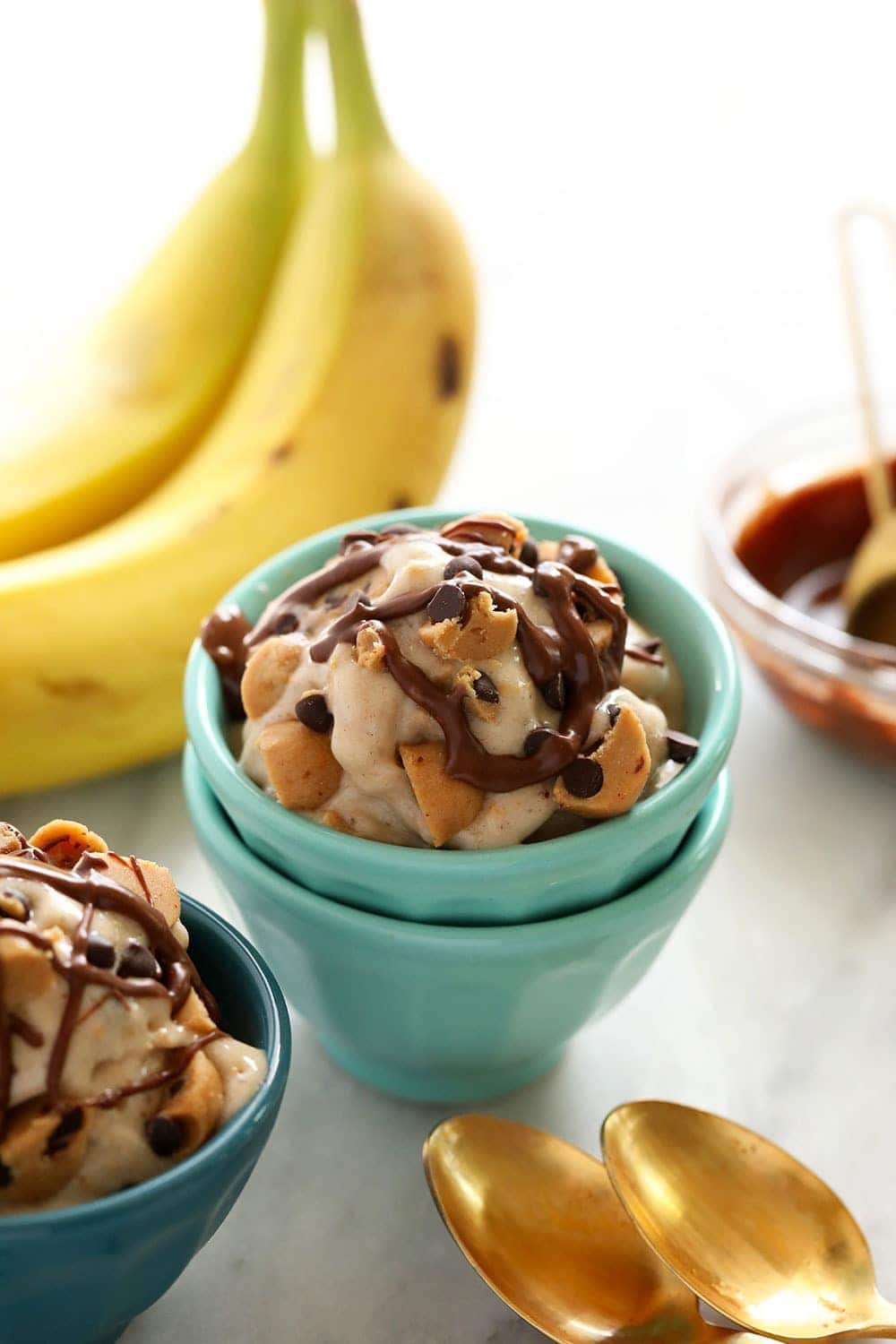 Bowls of vegan cookie dough banana softer serve.