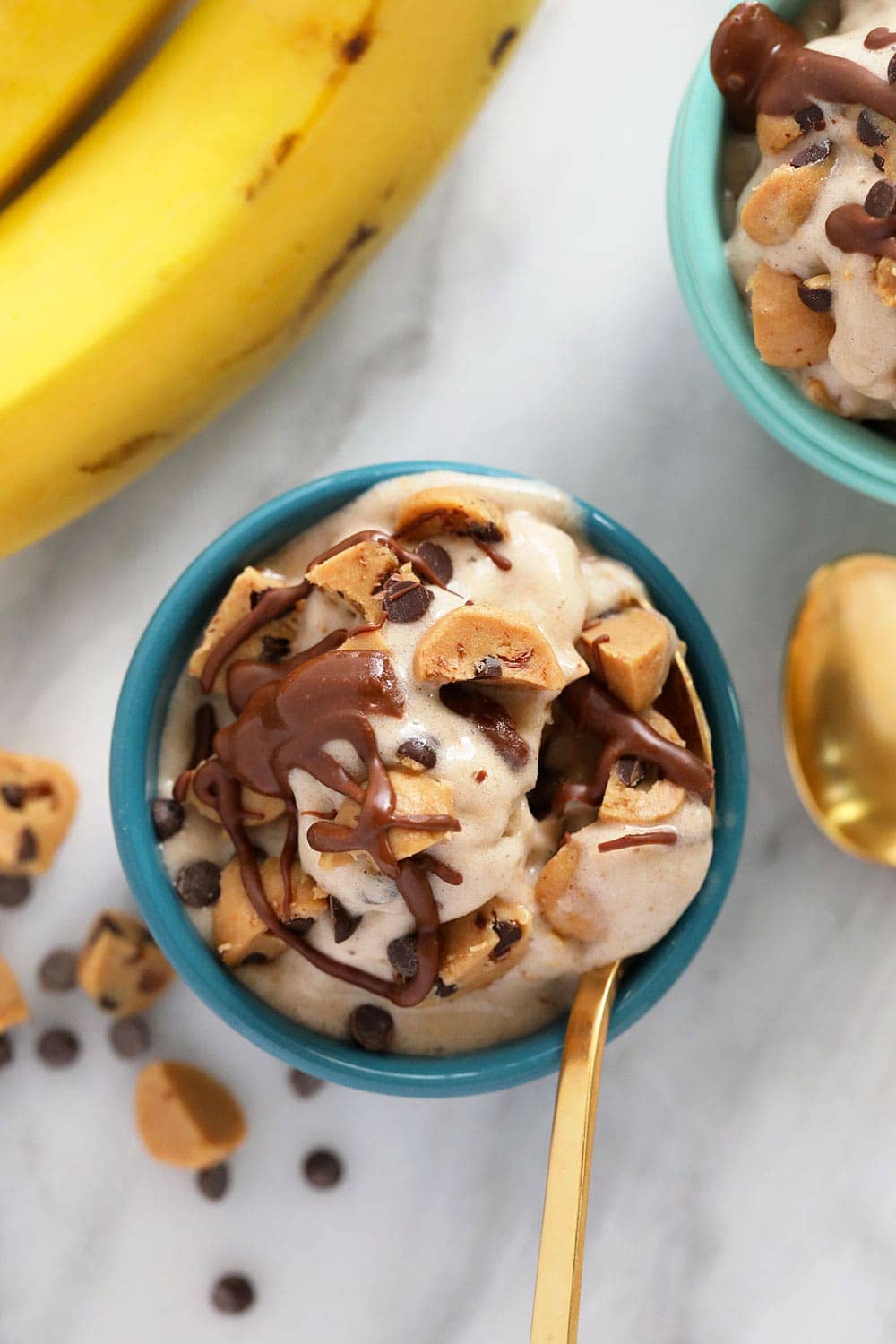 A bowl of cookie dough banana nice cream.