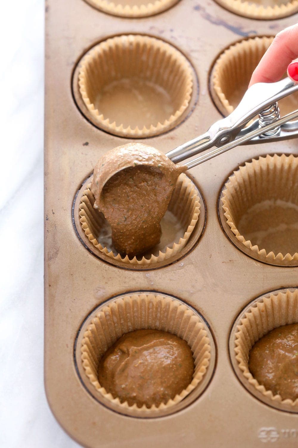 Filling muffin cups with batter