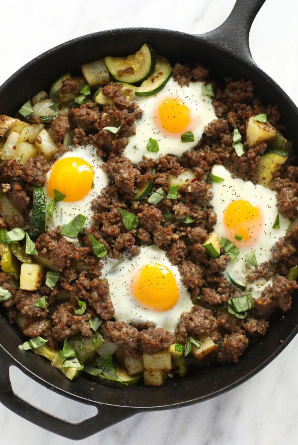 garden breakfast skillet topped with fresh basil