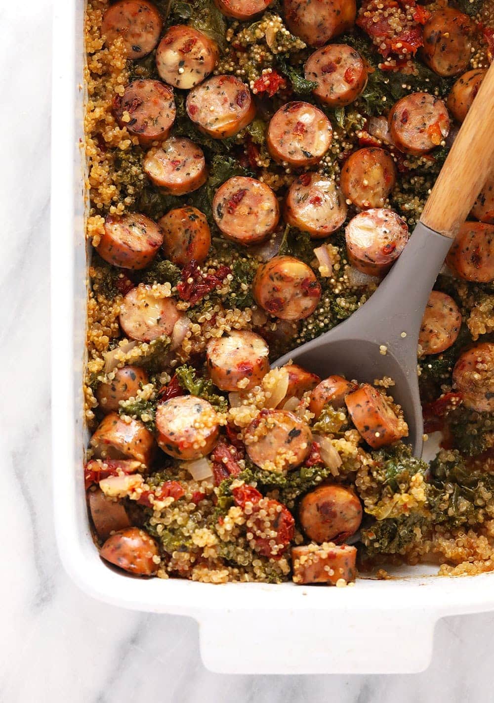 quinoa casserole with large serving spoon