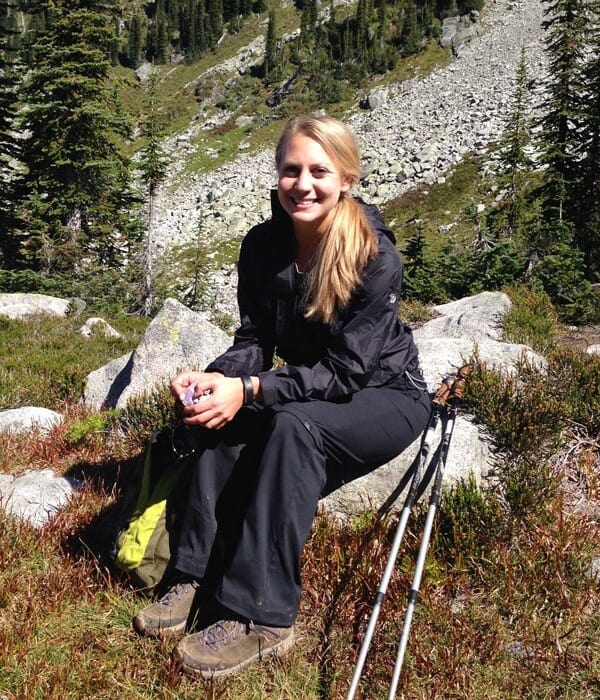 a woman using hiking poles during a Mountain Trek Review