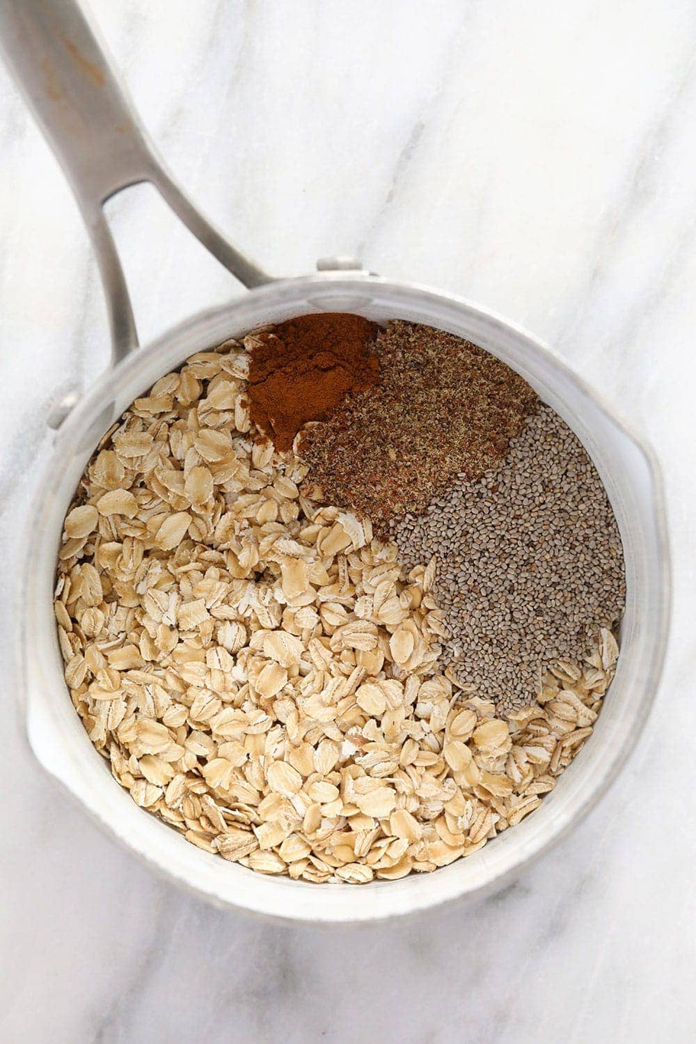 superfood oatmeal bowl ingredients in a pot ready to be cooked