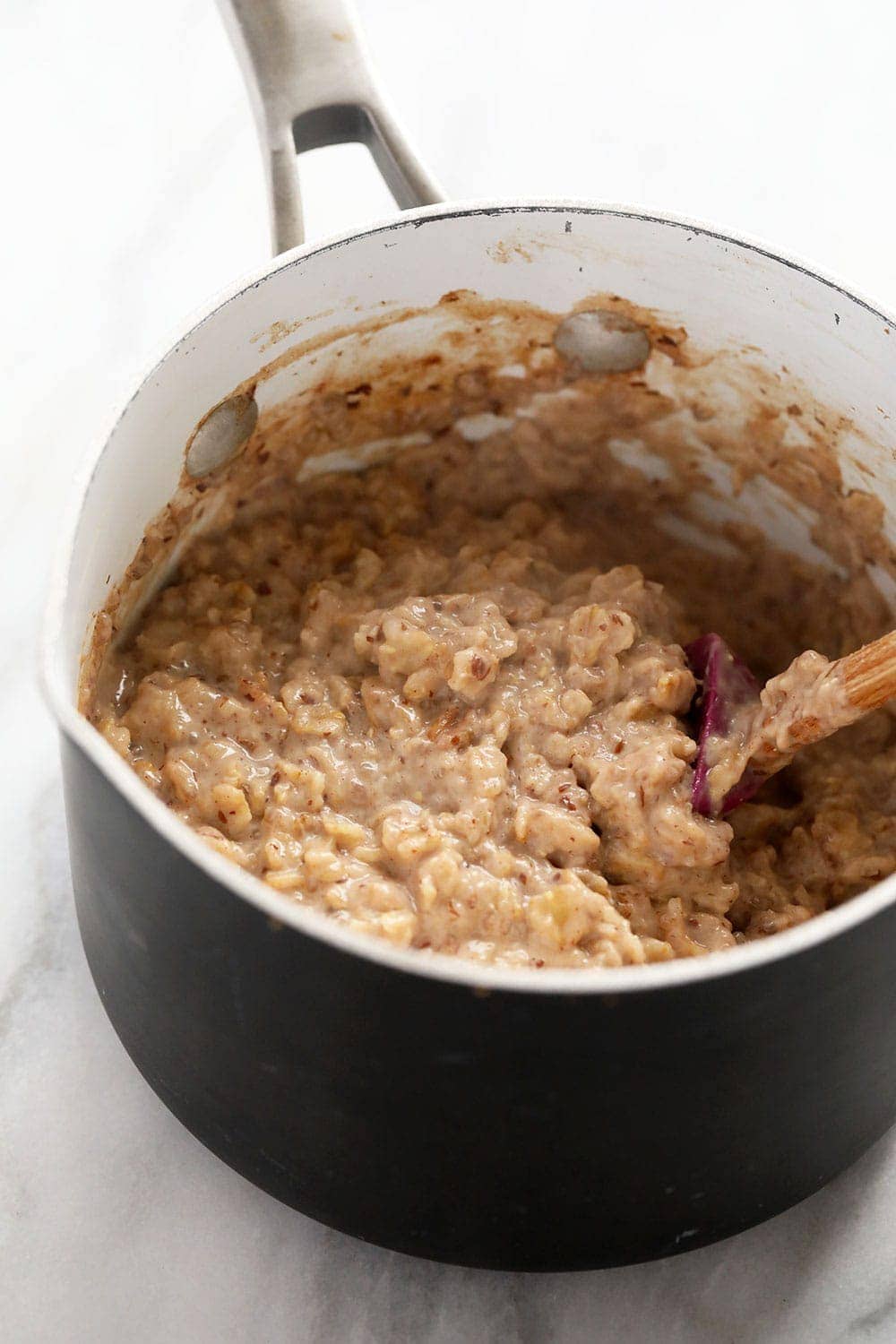 superfood oatmeal being mixed together in a pot