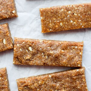 Peanut butter granola bars inspired by Copycat Cashew Cookie Lärabars, served on a piece of paper.