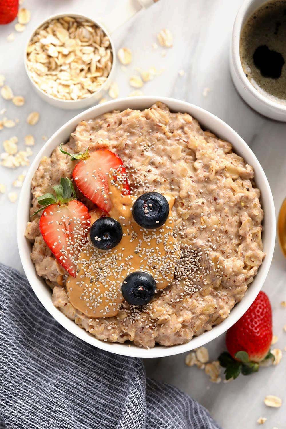 superfood oatmeal bowl topped with berries and chia seeds