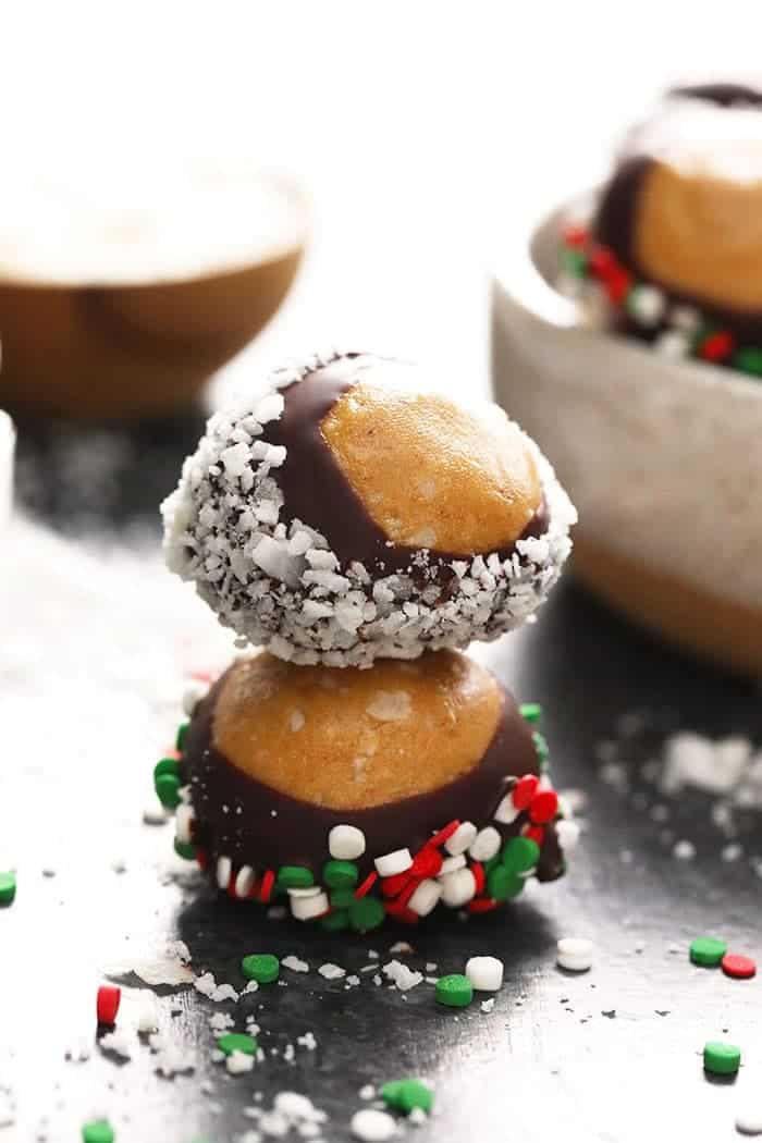 A stack of healthy chocolate covered peanuts with sprinkles on top.