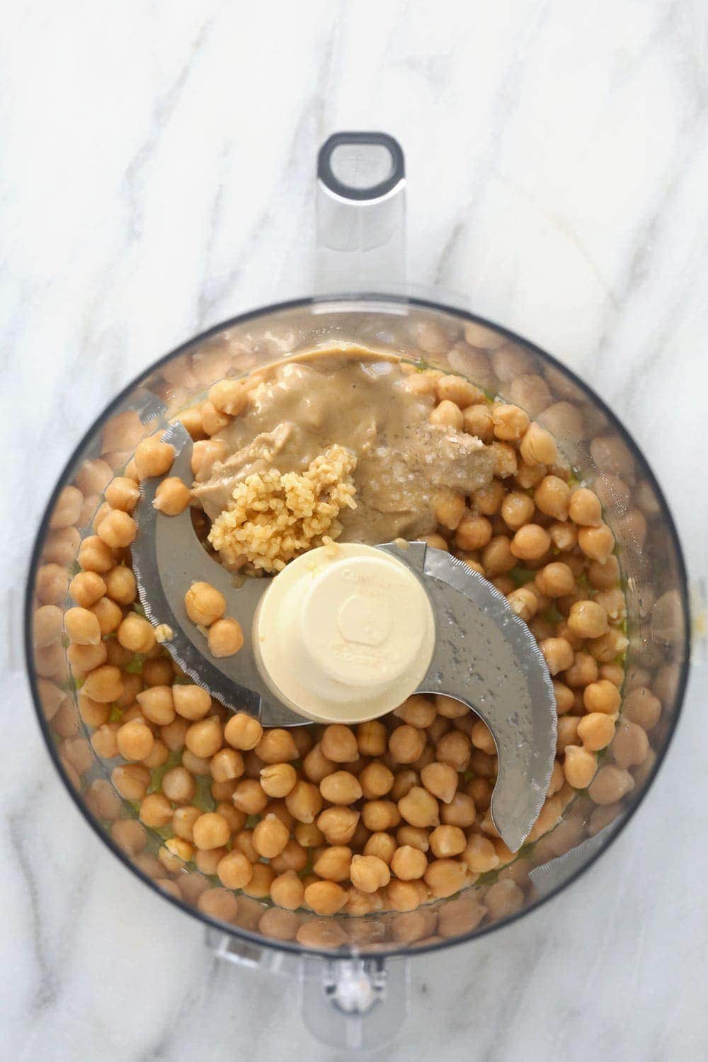 lemon garlic hummus ingredients in a food processor