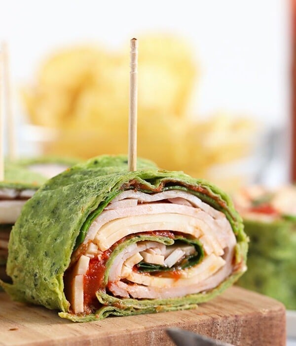 a turkey pinwheel on a cutting board