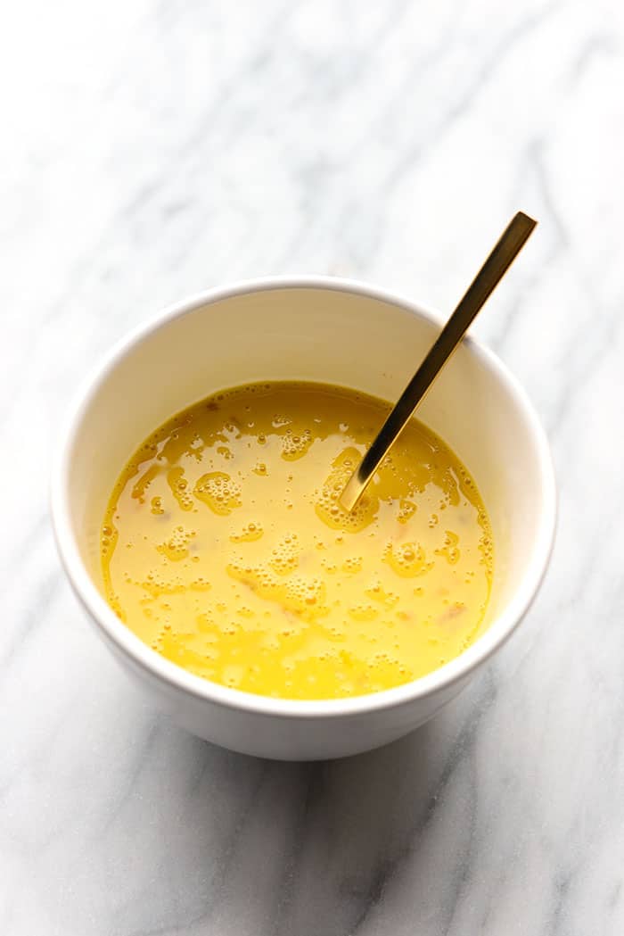 Bowl of egg mixture ready for bread slices to be dipped in. 