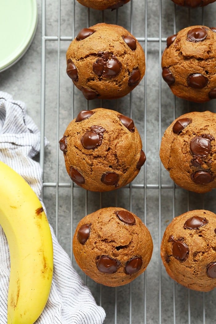 Banana chocolate chip muffins on a cooling rack.