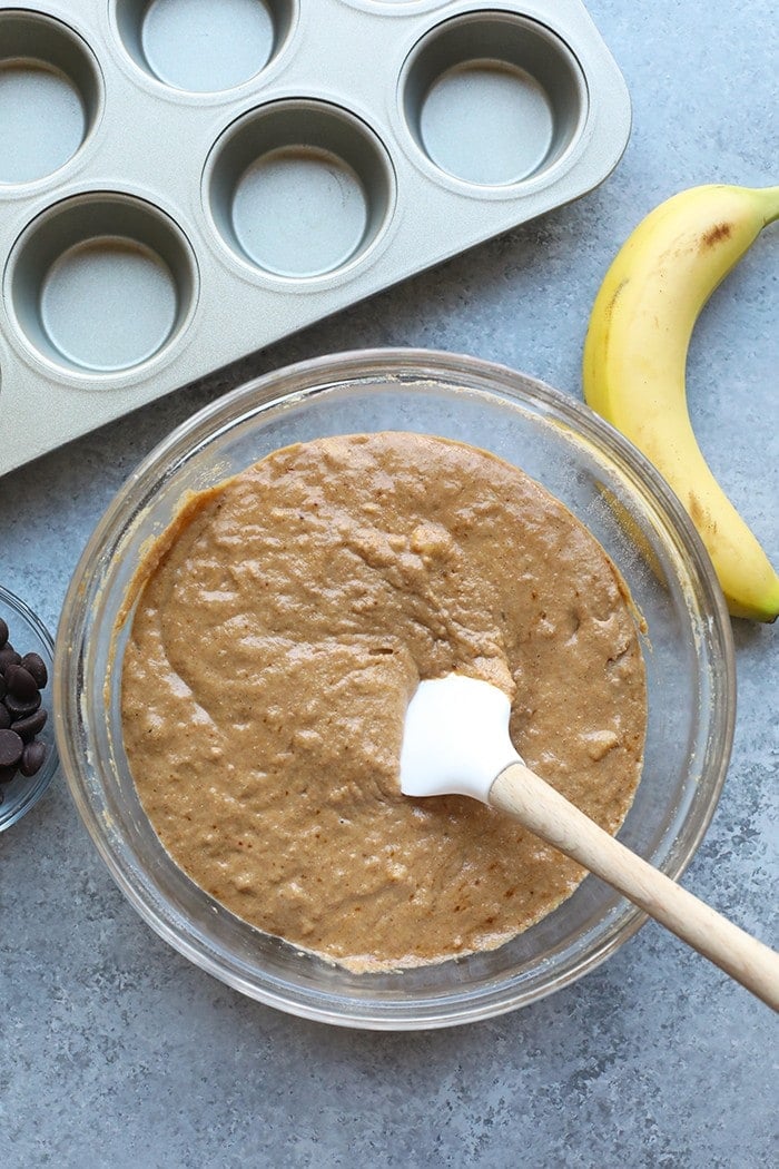 Banana chocolate chip muffin batter in a bowl.