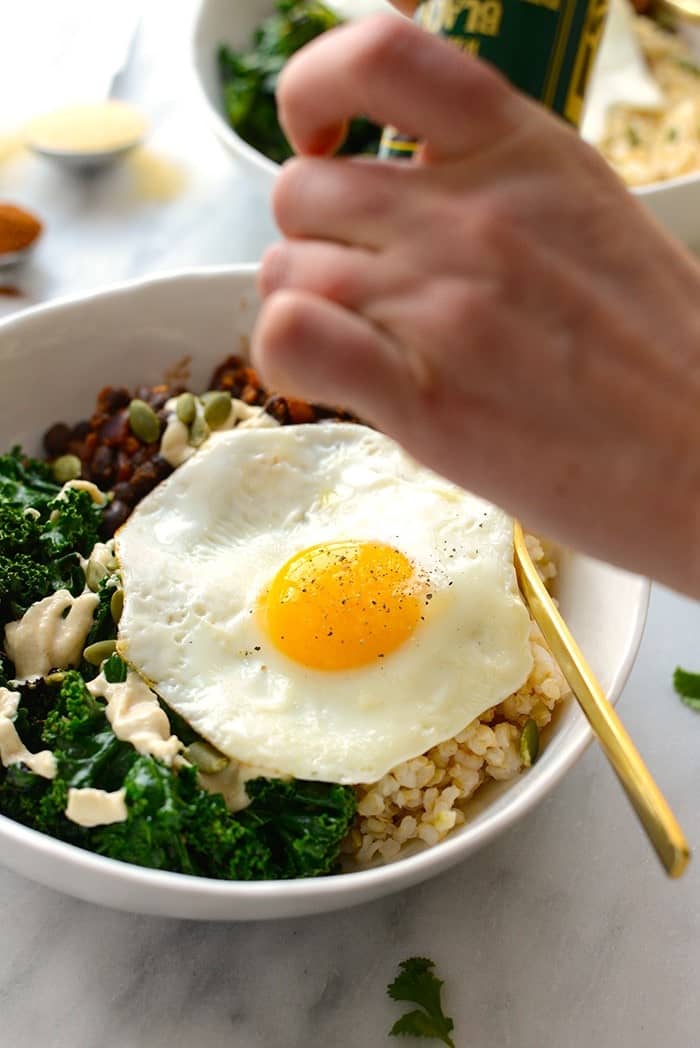 Make your breakfast a savory one and prep these delicious black bean breakfast bowls for the week! They're made with black beans, sautéed kale, brown rice, an egg, and all the fixins! 