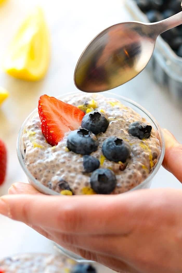 A spoon dipping into chia seed pudding