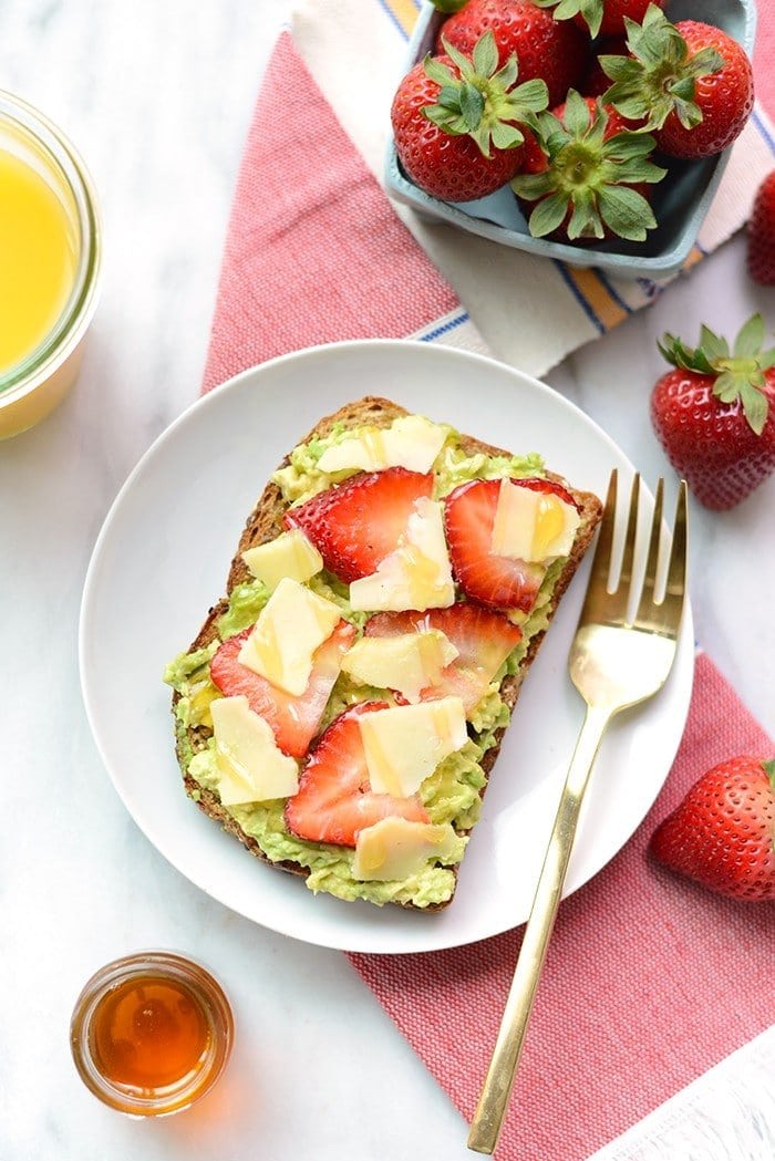 Jazz up your toast with some fresh fruit and cheese for an epic breakfast of Strawberry, Avocado, and White Cheddar Toast!