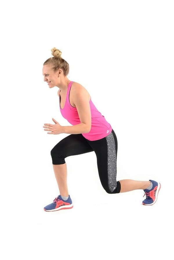 A woman doing a squat in a bikini for a bum workout on a white background.