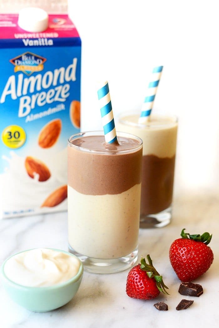 layered chocolate banana smoothie with almond breeze carton in the background