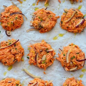 A tray of cheddar sweet potato hash browns on a baking sheet.