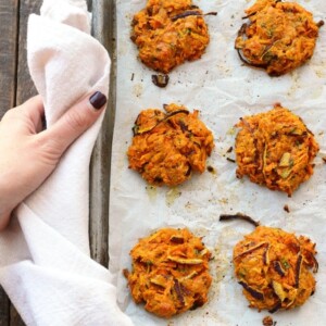 Cheddar sweet potato patties baked on a sheet.