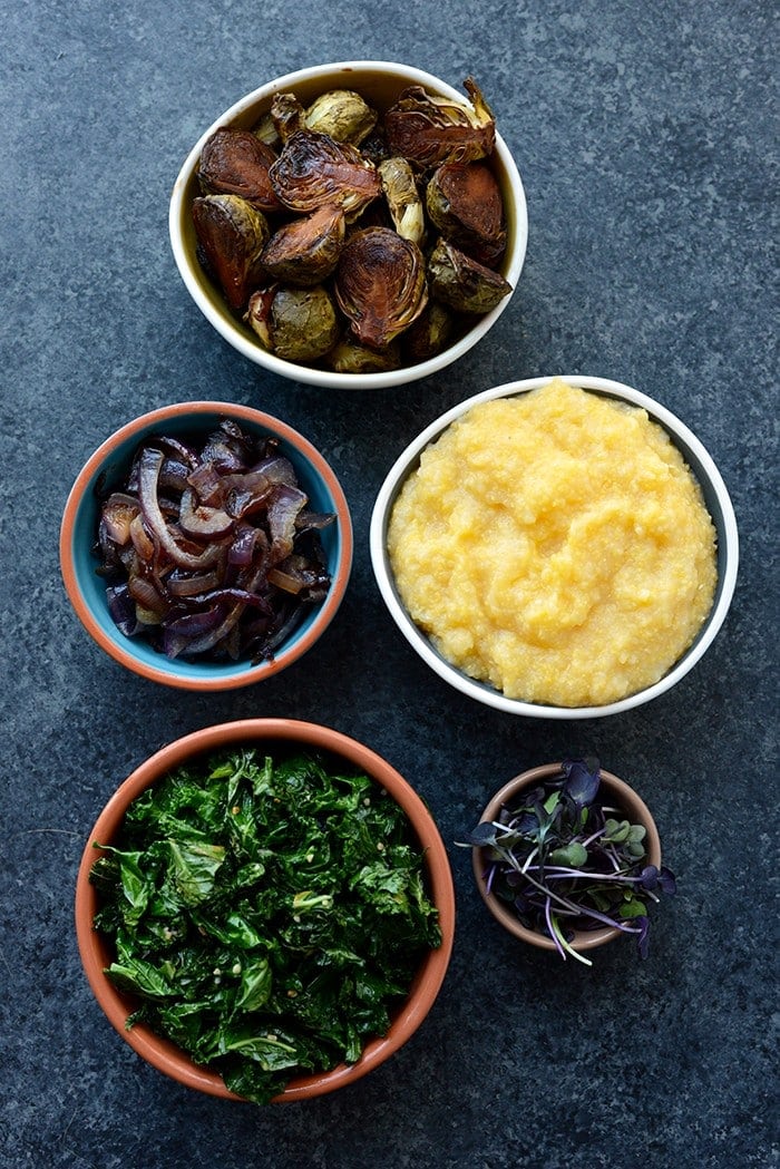 Vegetarian Meal Prep Idea: Meal prep like a vegetarian boss and make these Roasted Brussels Sprout Polenta Bowls fully equipped with caramelized onions and kale! 