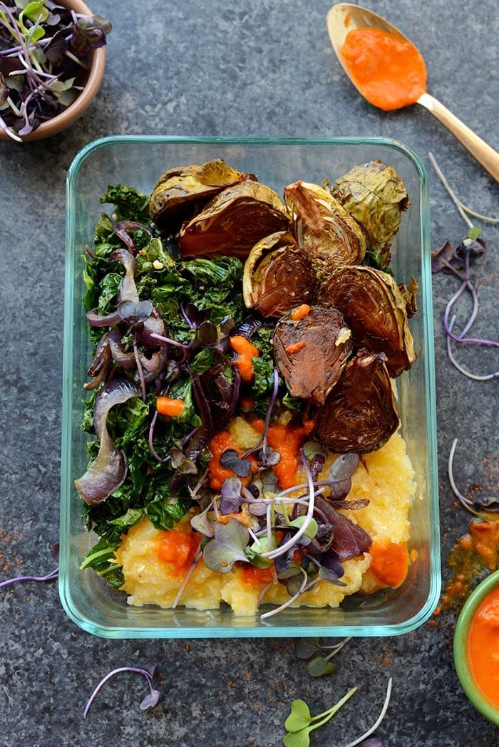 Vegetarian Meal Prep Idea: Meal prep like a vegetarian boss and make these Roasted Brussels Sprout Polenta Bowls fully equipped with caramelized onions and kale! 