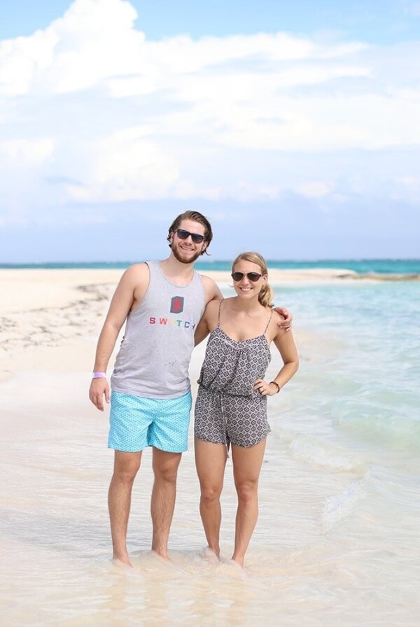 A couple enjoying Funjet vacation at Iberostar resort on a beach.