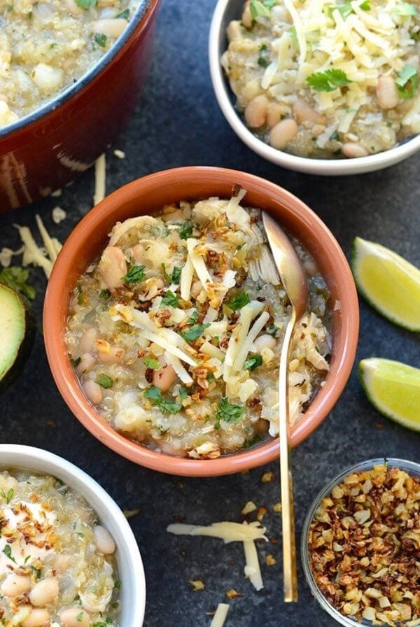 Mexican bean and cheese soup with four bowls.