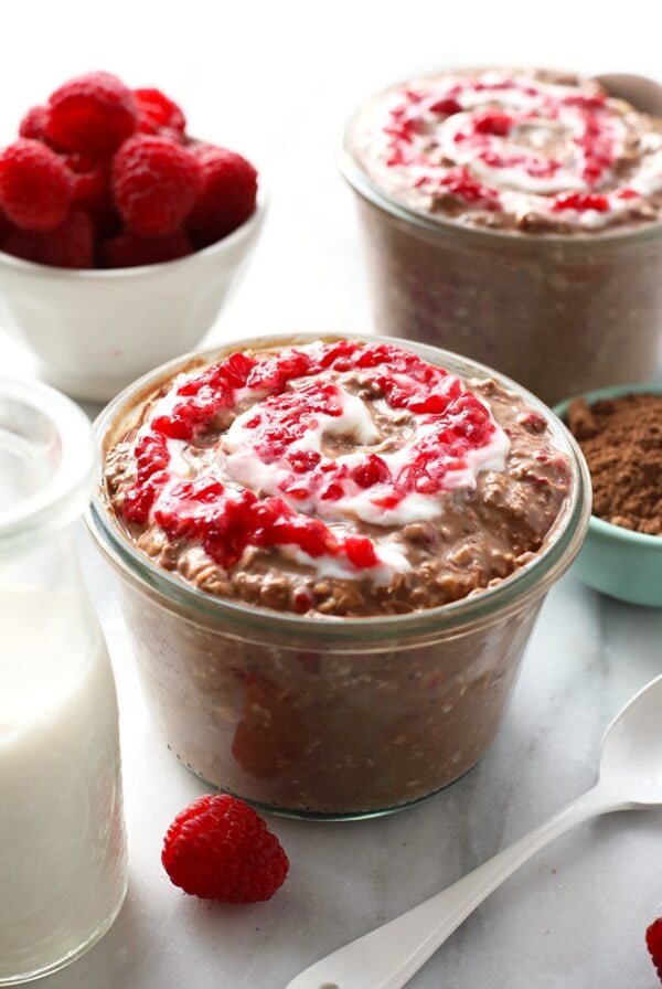 Chocolate Raspberry Cheesecake Overnight Oatmeal with Whipped Cream.