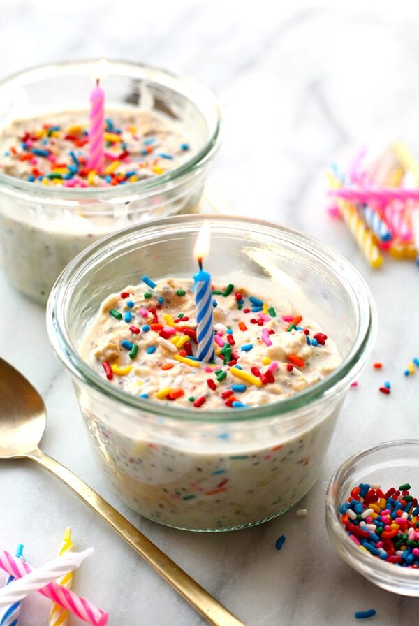 Two bowls of cake batter with candles and sprinkles transformed into delightful overnight oats.