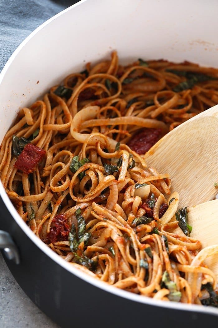 sun dried tomato pasta with whole wheat noodles in pan