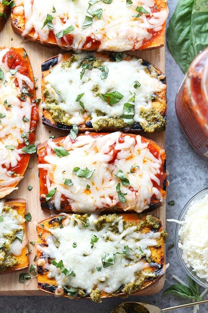 Wow the fam with these amazing grilled sweet potato pizzas! All you need is sweet potatoes, your favorite marinara sauce or pesto, mozzarella, and your favorite pizza toppings for this healthy 30 minute meal.