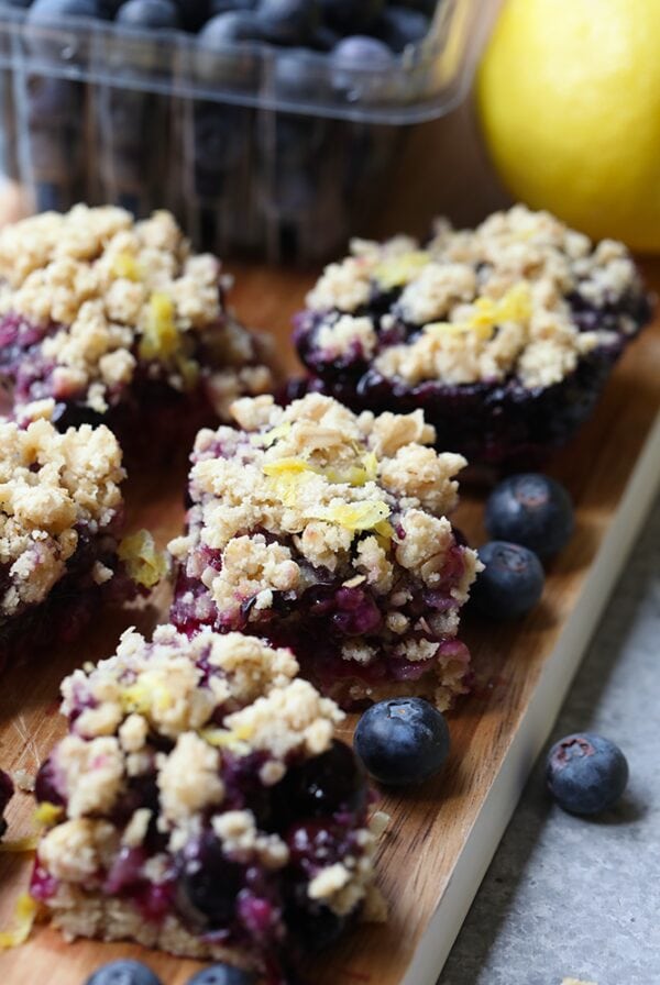 Lemon Blueberry Crumb Bars on a cutting board.