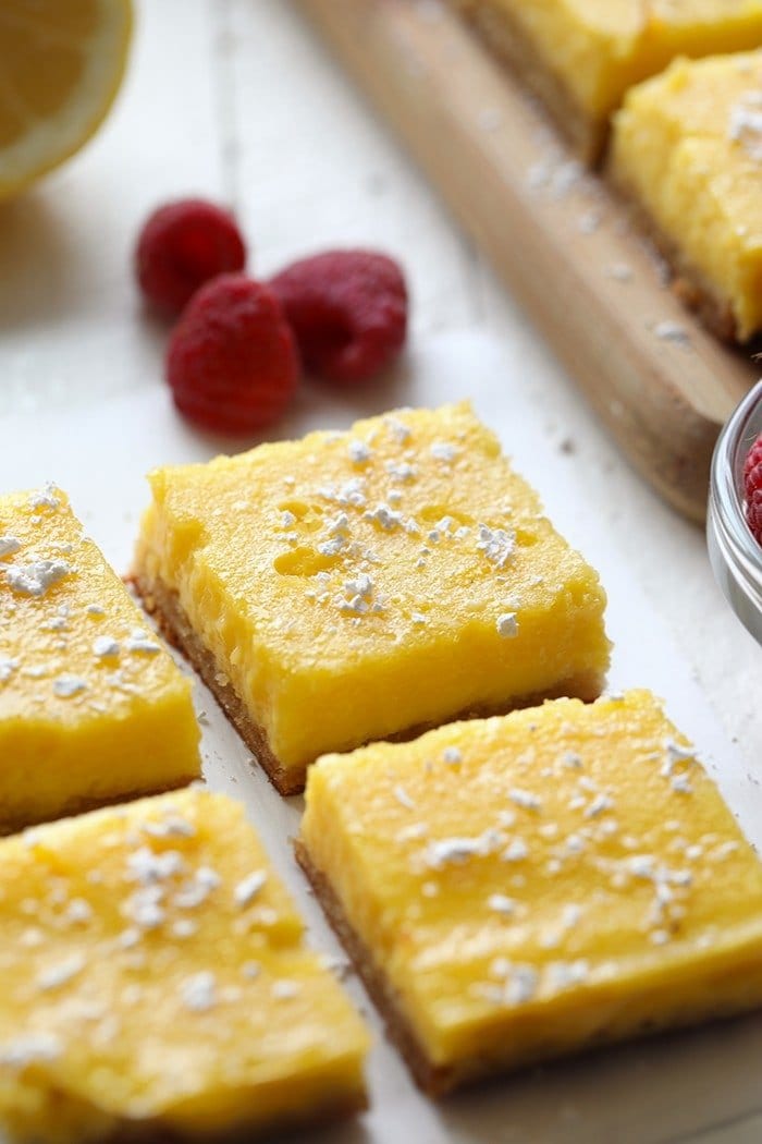 4 gluten free lemon bars with raspberries.