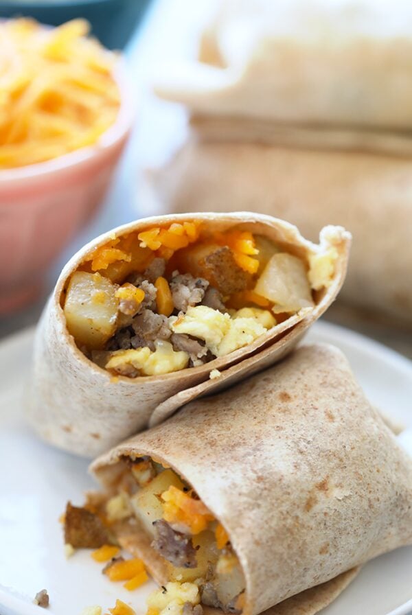 Frozen breakfast burritos with cheese and eggs.