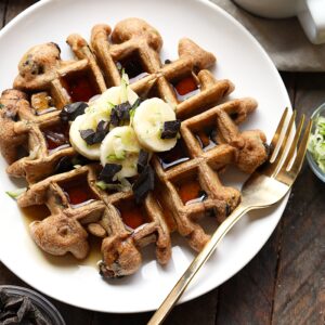 Chocolate chip and banana waffles, garnished with zucchini.