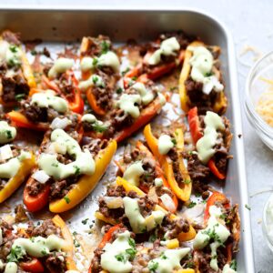 baking sheet topped with fajita stuffed peppers.