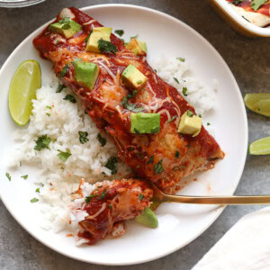 healthy enchilada served over rice topped with avocado