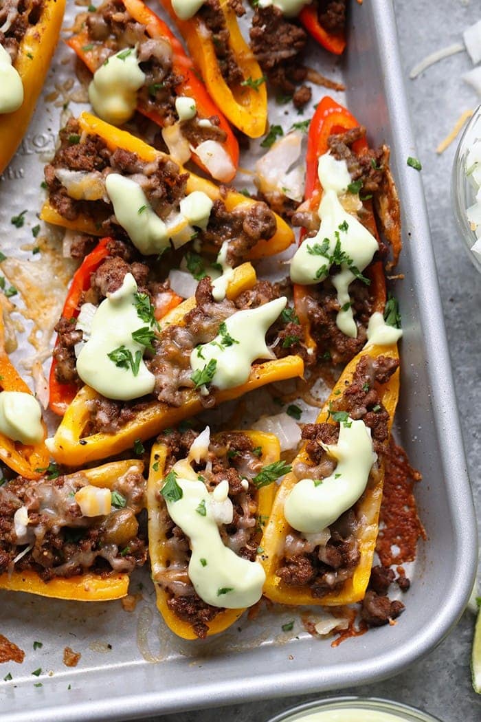 fajita nachos with avocado crema.