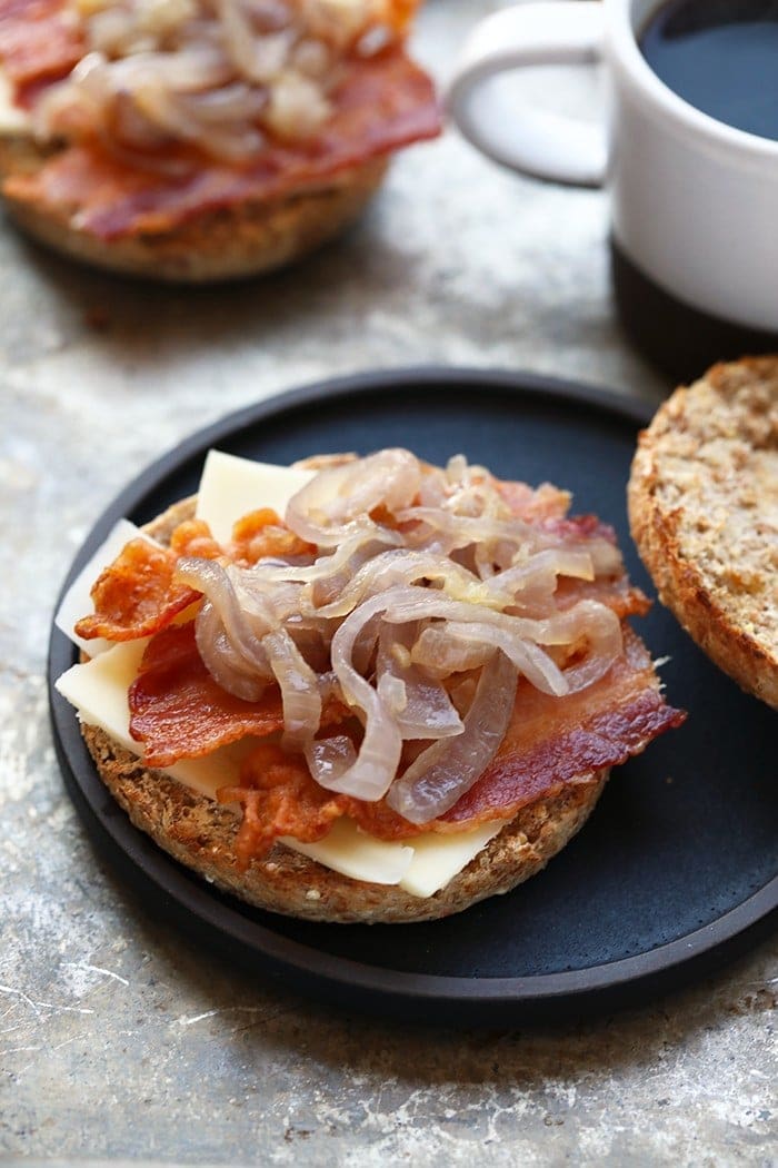 Start the morning off right with this Arugula Breakfast Sandwich with Caramelized Onions! This breakfast sandwich is a simple breakfast made with a whole grain English muffin, peppery arugula, and delicious caramelized onions that leave you with a full belly until lunch! 