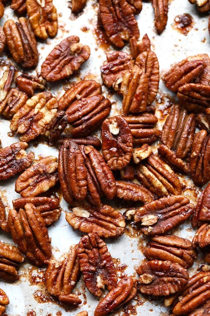 Roasted pecans on baking sheet.