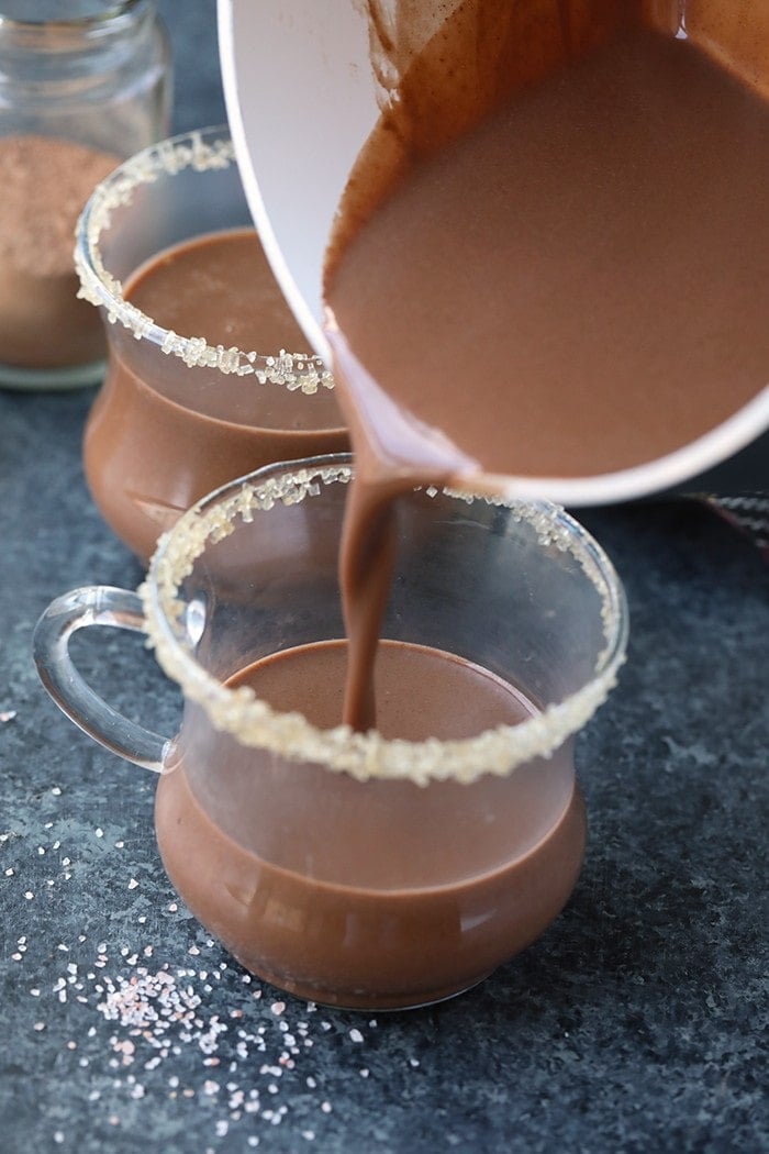 This decadent spiced coconut hot chocolate is made with full-fat coconut milk, a mixture of warm spices, and maple syrup. It's both vegan and paleo-friendly, perfect for the health-minded people out there!