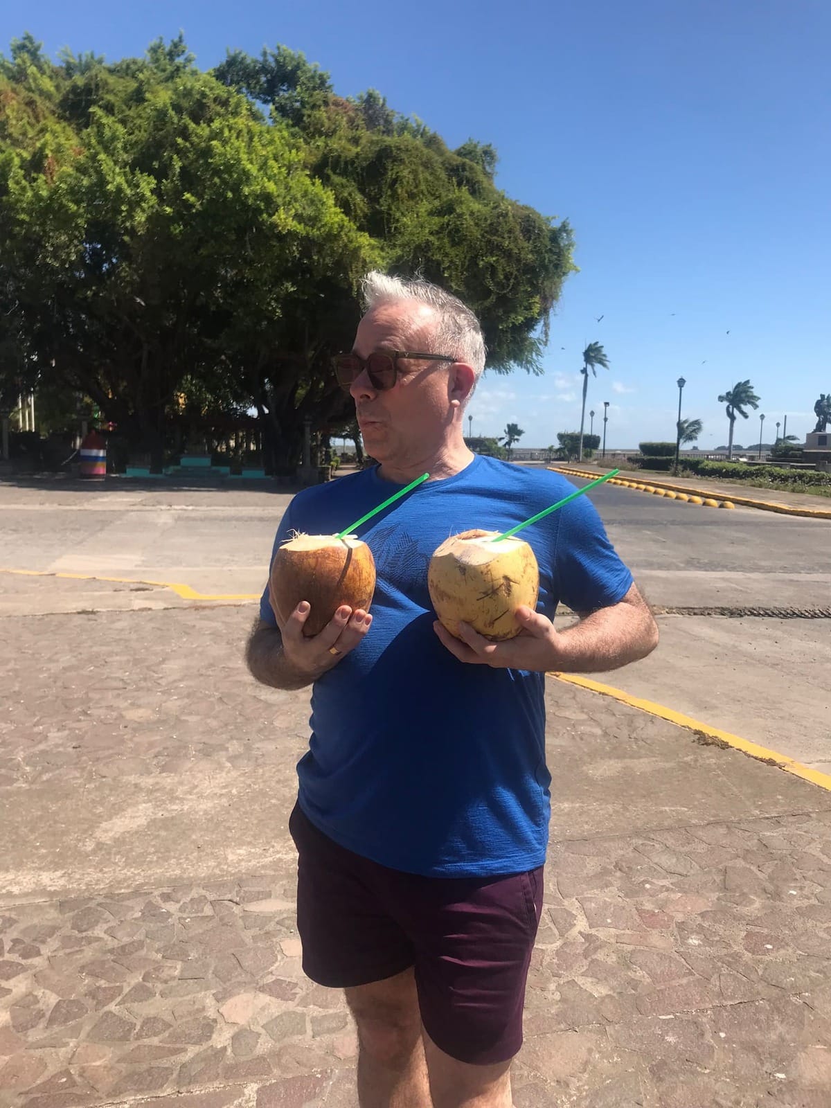 Man with coconuts. 