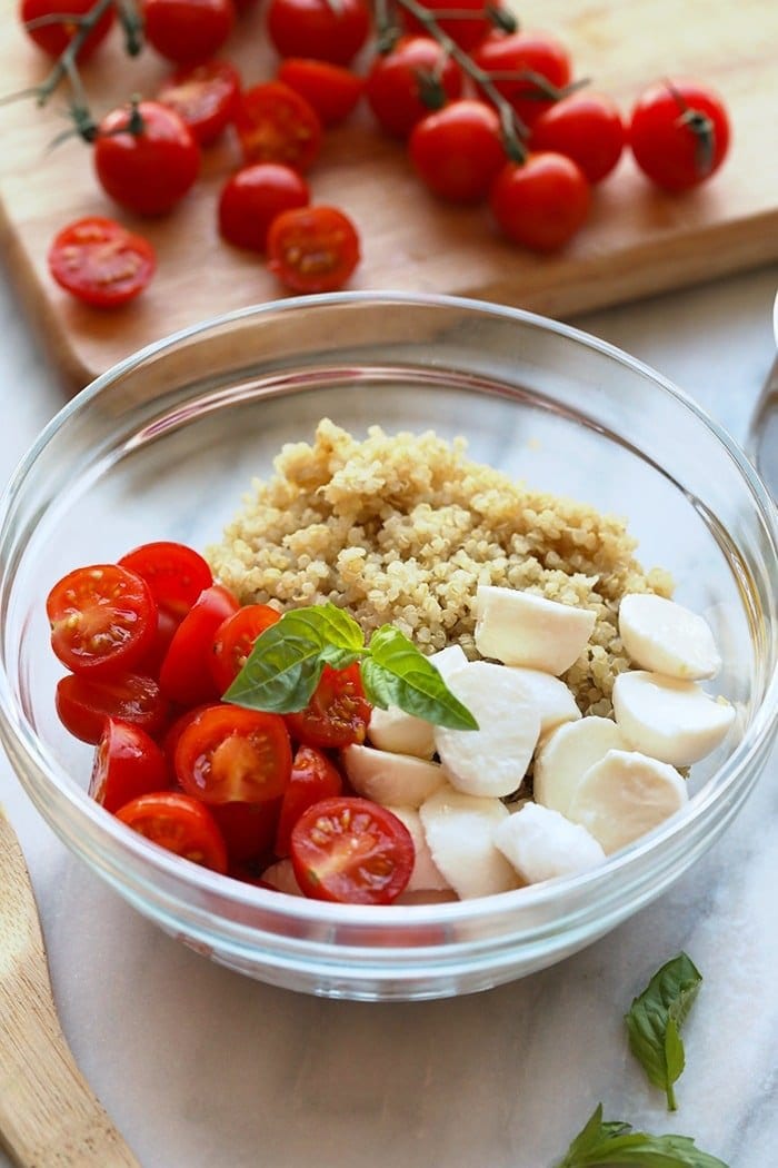 fresh caprese quinoa salad ingredients in a bowl