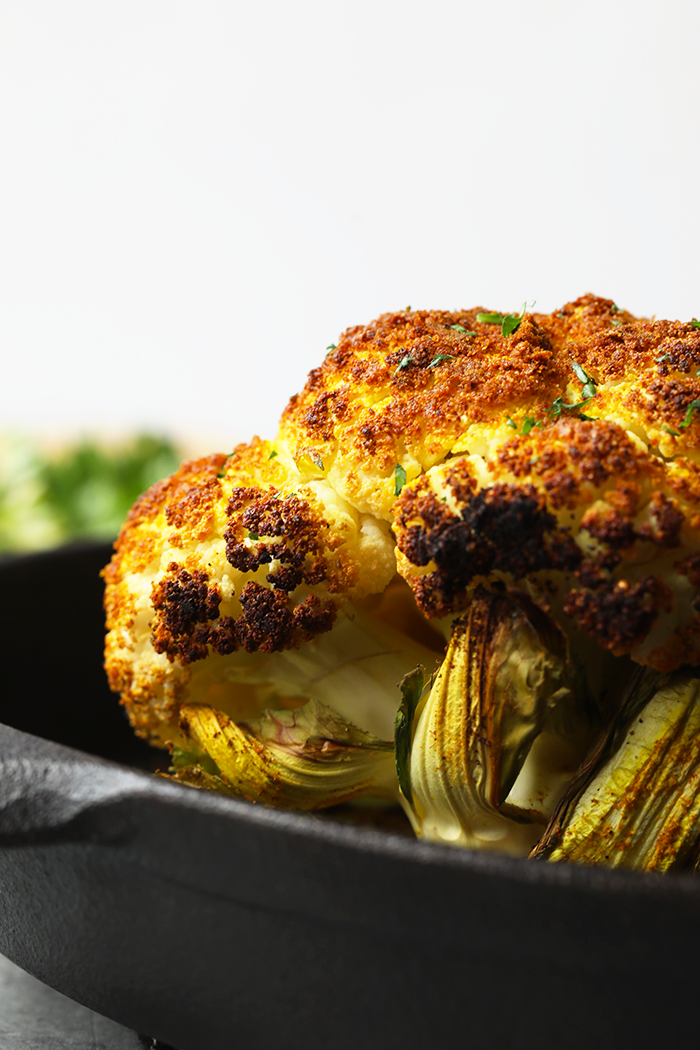 finished roasted cauliflower in a cast iron pan