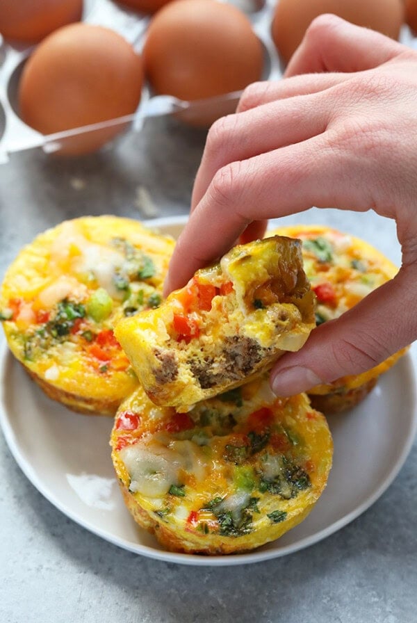 This turkey fajita egg cup recipe is made with lean ground turkey, colorful green and red peppers, onions, and your favorite fajita spices! Don’t forget about the cheese on top. Whip up a batch of these egg muffin cups for a healthy meal prep breakfast option!