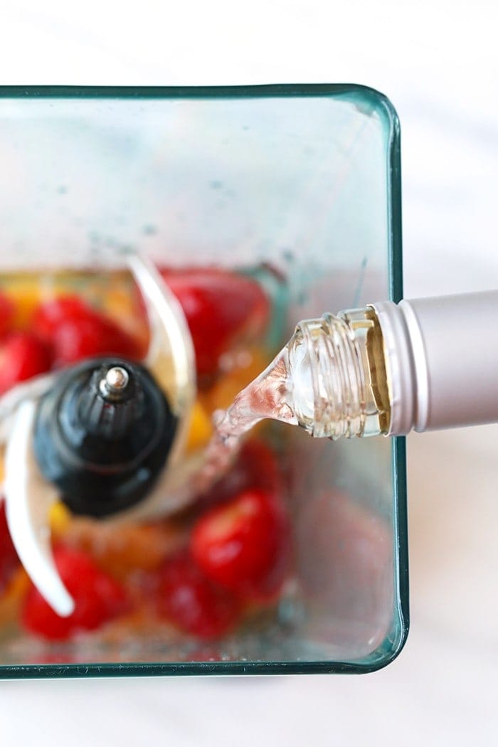 rum pouring into blender.